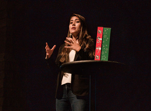 Woman speaking to crowd.