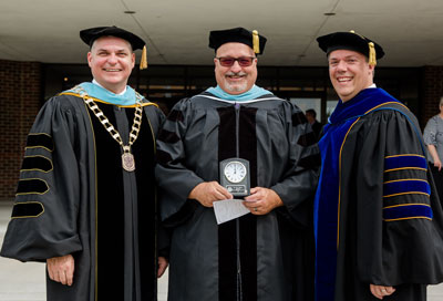 Dr. Kevin Patterson (center), chair of SBU's graduate studies in education, was named Faculty Newcomer of the Year.