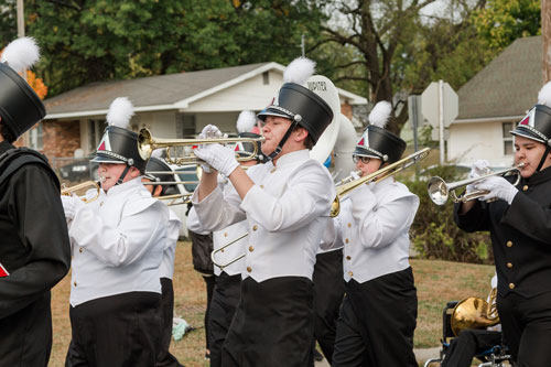 Band members playing instruments in SBU parade