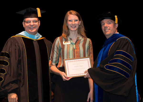 Natalie O'Keefe is presented with the Staff Newcomer of the Year award.