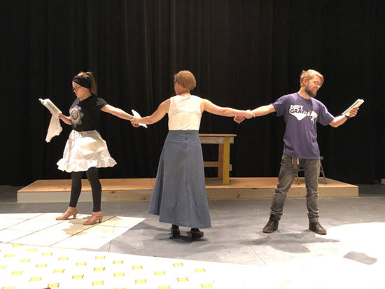 Theatre students rehearse a scene.