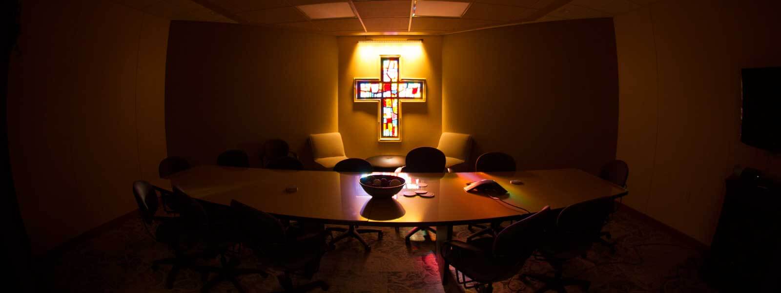 stained glass cross window in conference room