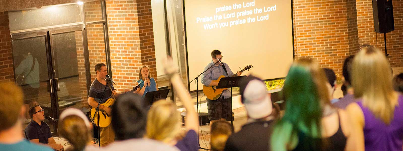 student-led worship service at outdoor amphitheater