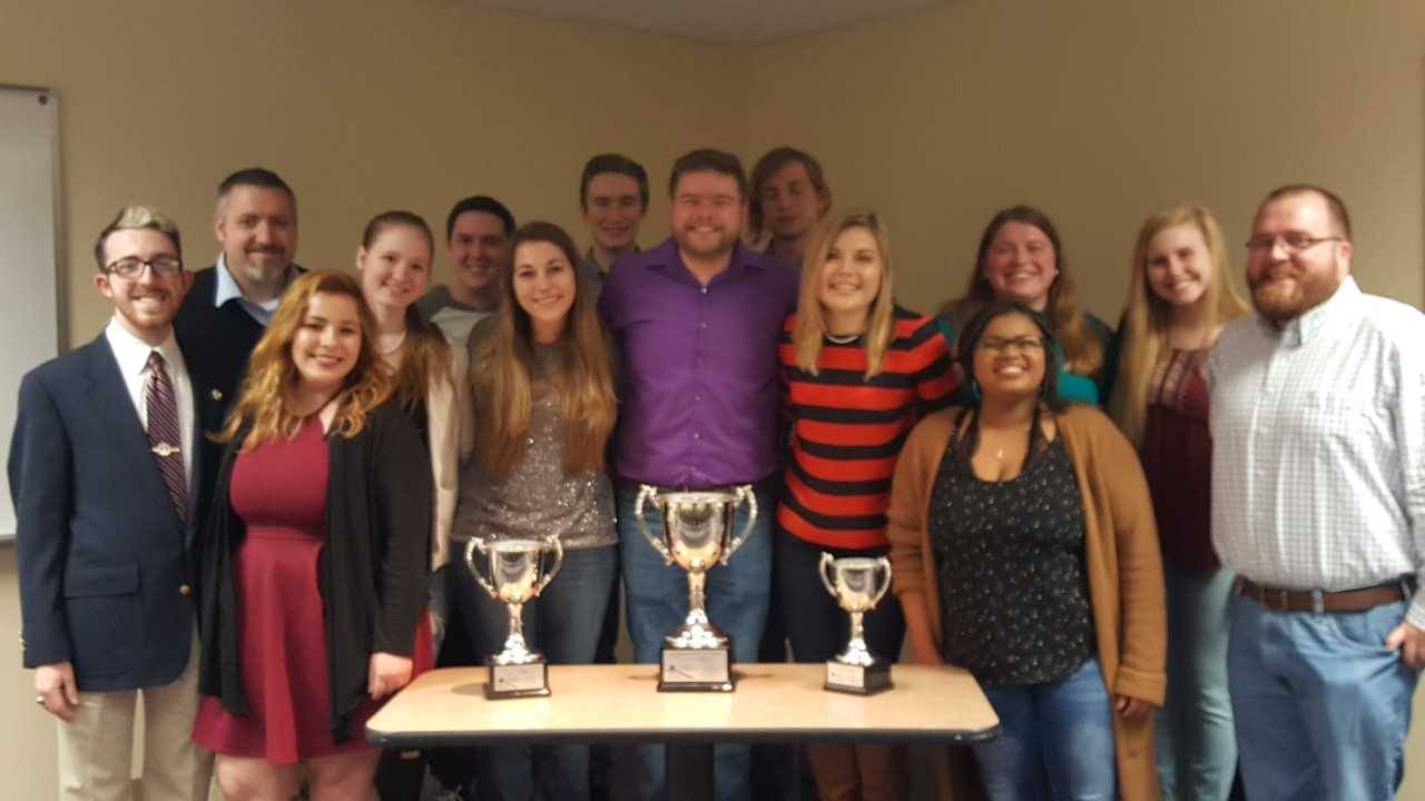 SBU's Speaking Bearcats pose with their sweepstakes trophies.